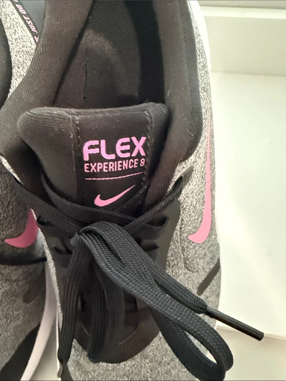 Nike Women's Gray Athletic Sneakers with Pink Swoosh